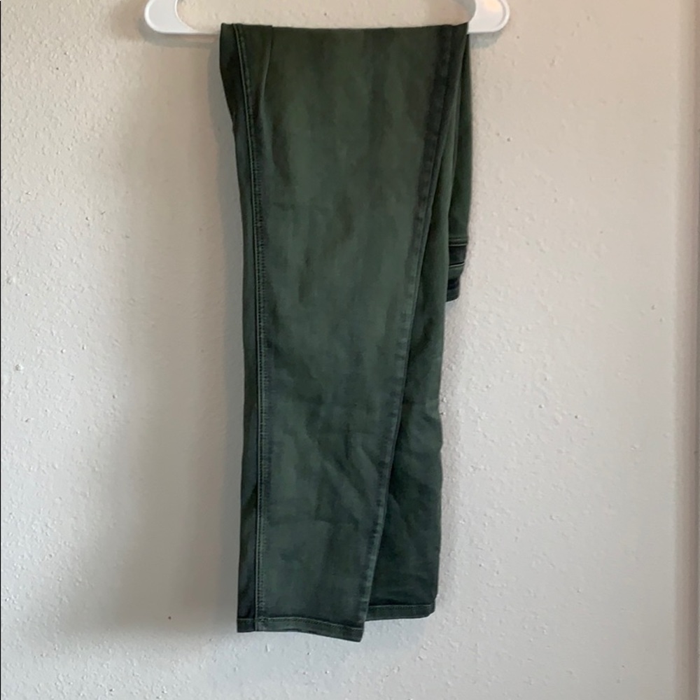 Green distressed skinny jeans